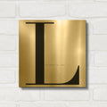 'L is for Love on White' By Mercedes Lopez Charro Gold Metal Wall Art